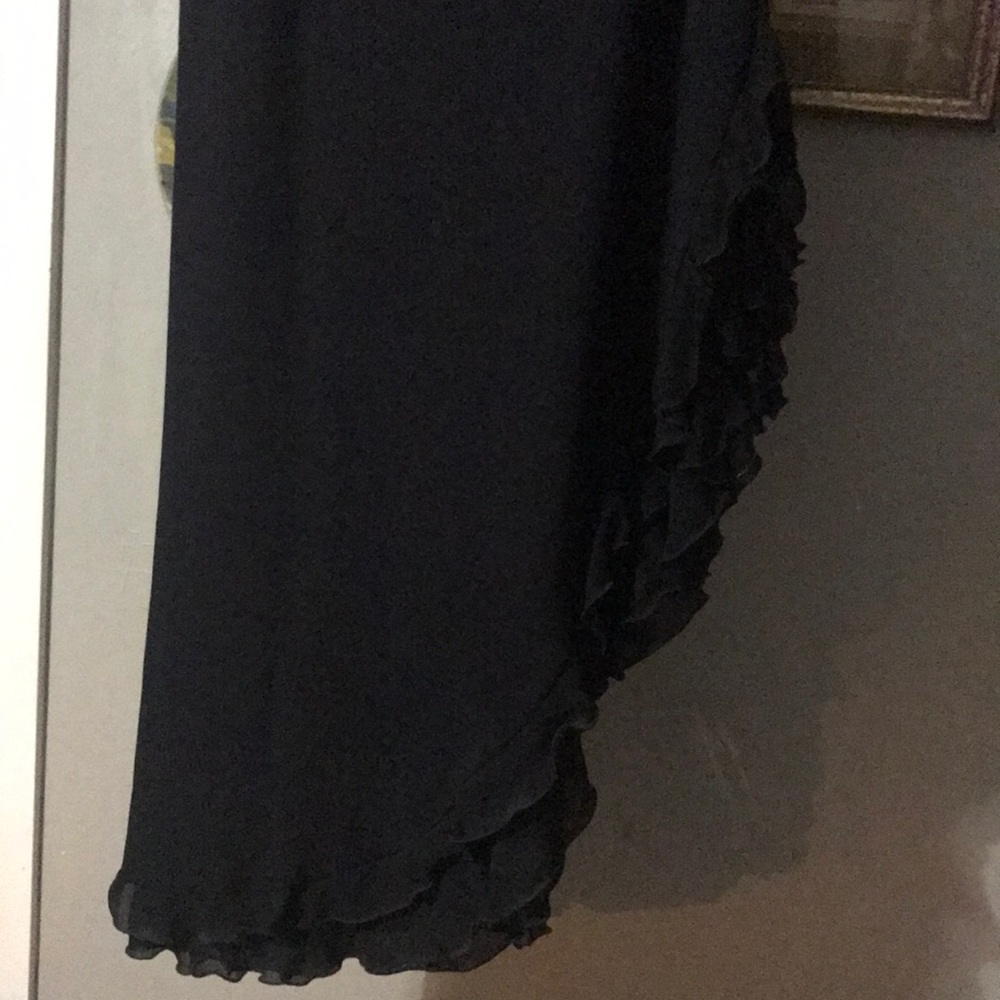 Black skirt with high slit on side.